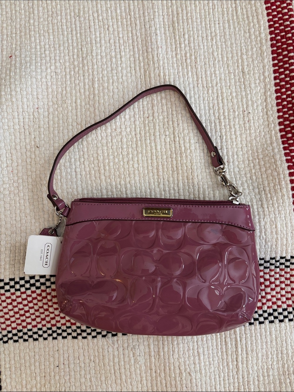 Coach Glossy Signature Patent Wristlet in Plum Pink